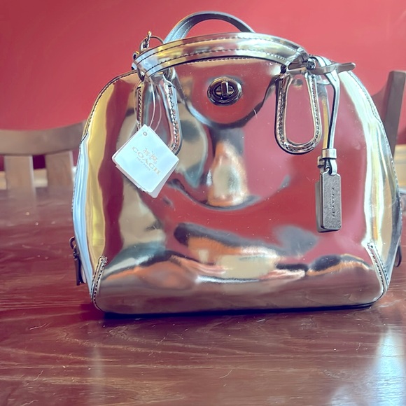 Coach mini silver top handle bag w/detachable cross-body...